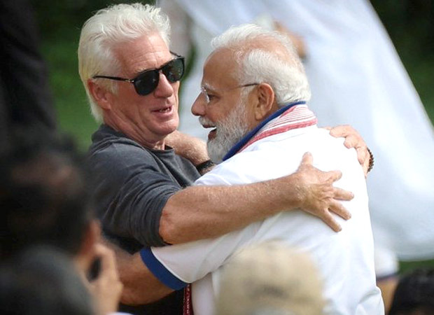 Richard Gere hugs Prime Minister Narendra Modi at UN headquarters: This sense of universal brotherhood and sisterhood is the message we want to hear again and again, Ahead of the event, Gere spoke to ANI and said, He (PM Modi) is a product of Indian culture and comes from a vast place as Indian culture does. This sense of universal brotherhood and sisterhood is the message we want to hear again and again. Gere was performing some asanas led by PM Modi. In one of the photos, he was also seen hugging the politician. 