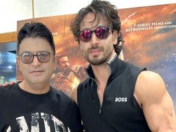 Tiger Shroff & Bhushan Kumar pose for paps at T-Series office