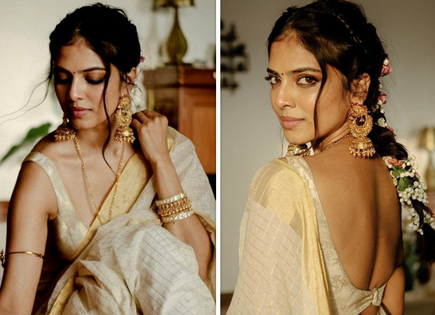 Malavika Mohanan, dressed in a traditional golden saree, transcends us to a  timeless epoch -