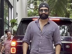 Vicky Kaushal smiles as he poses for paps