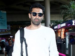 Aditya Roy Kapur poses with fans as he gets clicked at the airport