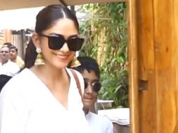 Mrunal Thakur poses with her little brother as she gets clicked by paps
