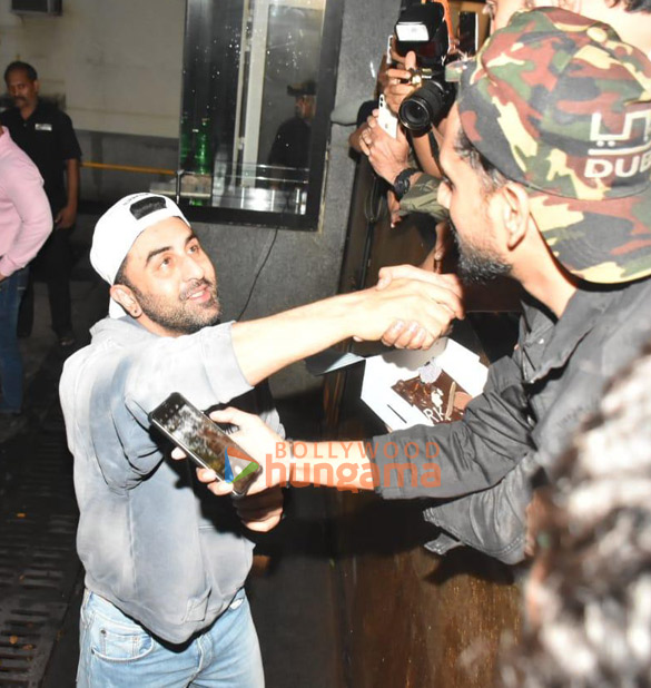 photos ranbir kapoor snapped cutting cake with fans and media outside bandra home 8