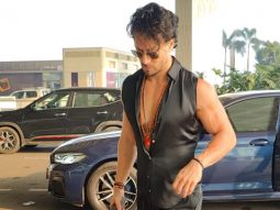 Tiger Shroff rocks a cut sleeve satin shirt at the airport