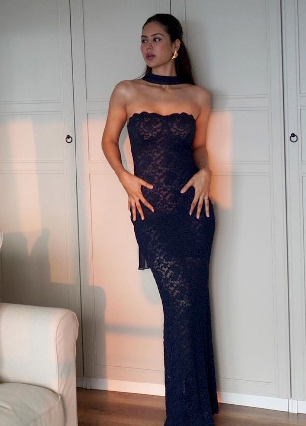 Sonam Bajwa stuns in a mesmerizing blue floral gown, complemented by a sleek scarf adorning her neck