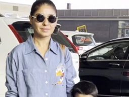 Sunidhi Chauhan poses with her son Tegh at the airport