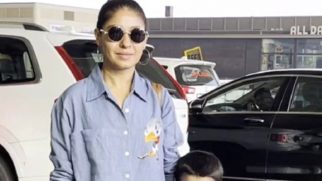 Sunidhi Chauhan poses with her son Tegh at the airport