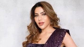 Nikki Tamboli shines in her shimmery black saree!