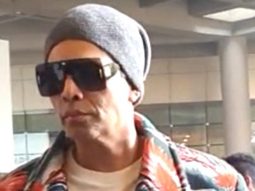 Karan Johar greets paps as he gets clicked with Yash & Roohi at the airport