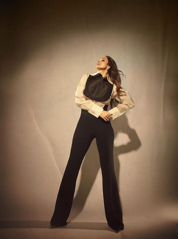 Malaika Arora is keeping it edgy in white cropped shirt and black high waist pants by Pankaj & Nidhi