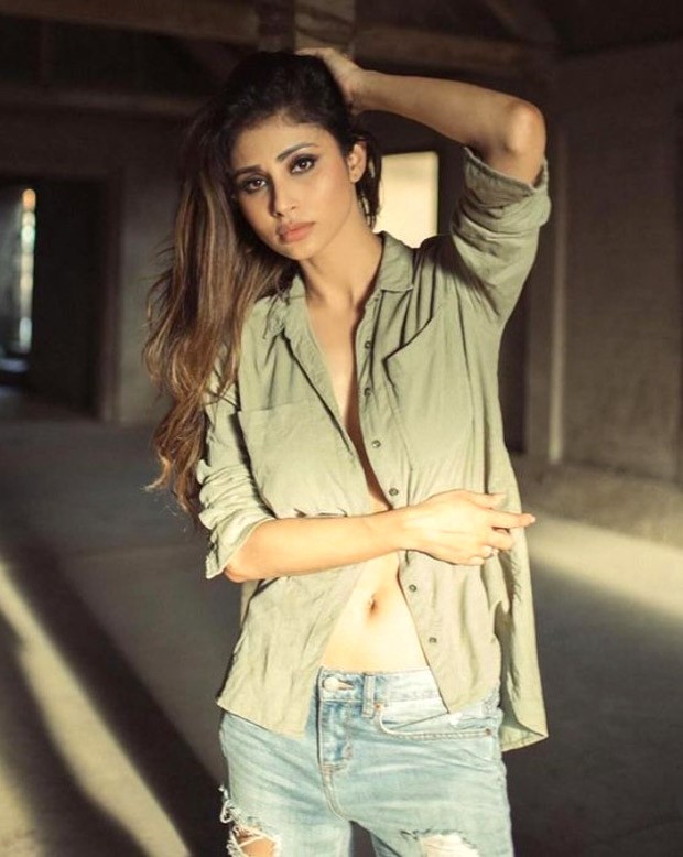 Mouni Roy is raising the temperature in sage green shirt and ripped denim jeans