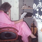 Zeenat Aman snapped during vanity van reading session; see pic