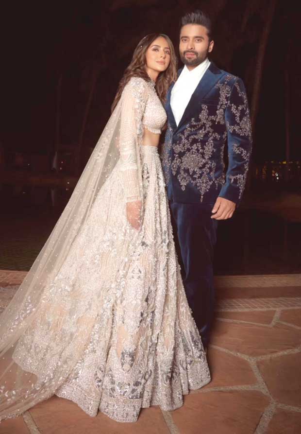 Rakul Preet Singh shines in a silver Falguni & Shane Peacock lehenga as Jackky Bhagnani lifts her in his arms during sangeet ceremony