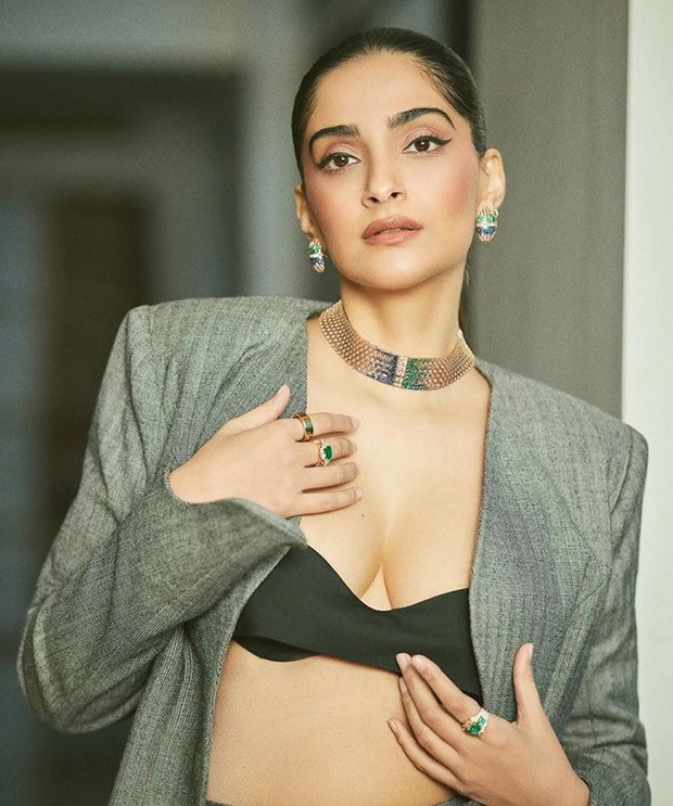 Sonam Kapoor shines in chic elegance at the jewellery event, donning a striking black tube top and flowing pleated skirt