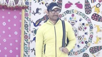 Aamir Khan poses for paps in a bright yellow hoodie as he leaves from Jamnagar