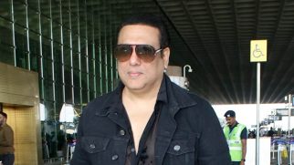 Govinda looks dapper dressed in all black as he smiles for paps at the airport
