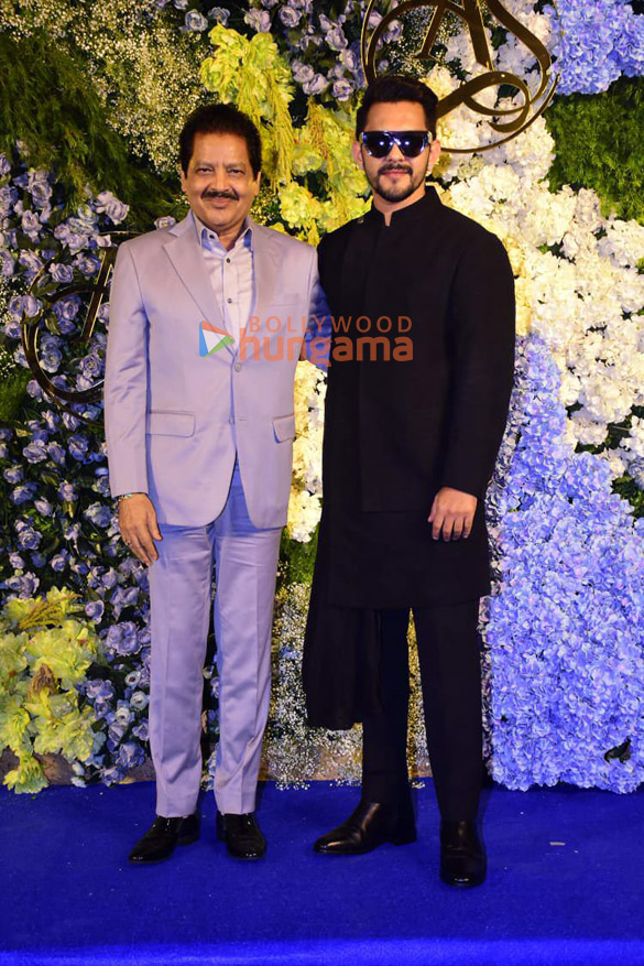photos producer anand pandit and family snapped with daughter aishwarya and son in law sahil at their wedding reception 21