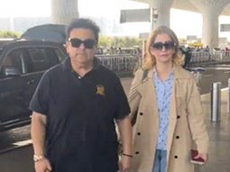 Adnan Sami poses with family as he gets clicked at the airport