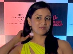 Mannara Chopra plays with a pup as she gets clicked in her pretty neon dress