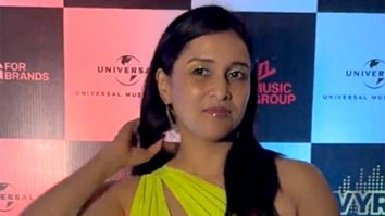 Mannara Chopra plays with a pup as she gets clicked in her pretty neon dress