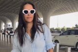 Neha Dhupia smiles for paps as she gets clicked at the airport