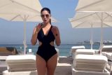 Beachside babe! Sunny Leone is making heads turn in a black bikini