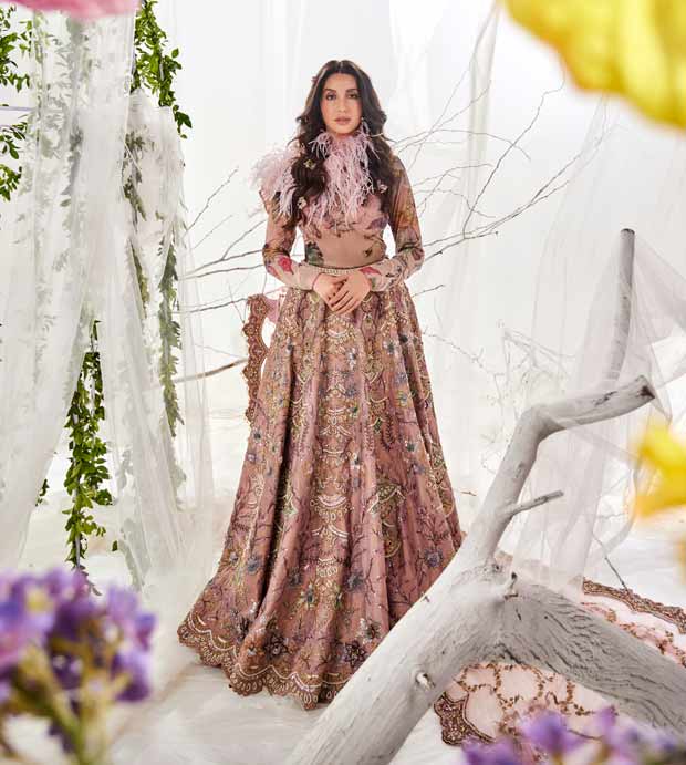 Nora Fatehi dazzles in classic metallic silk lehenga by Varun Bahl paired with bodysuit and pink feather collar