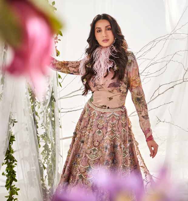 Nora Fatehi dazzles in classic metallic silk lehenga by Varun Bahl paired with bodysuit and pink feather collar