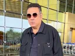 Boman Irani clicks a picture with paps as he gets clicked at the airport
