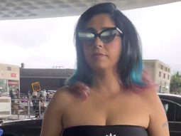 Neha Bhasin sports an all black airport look with her funky hair color