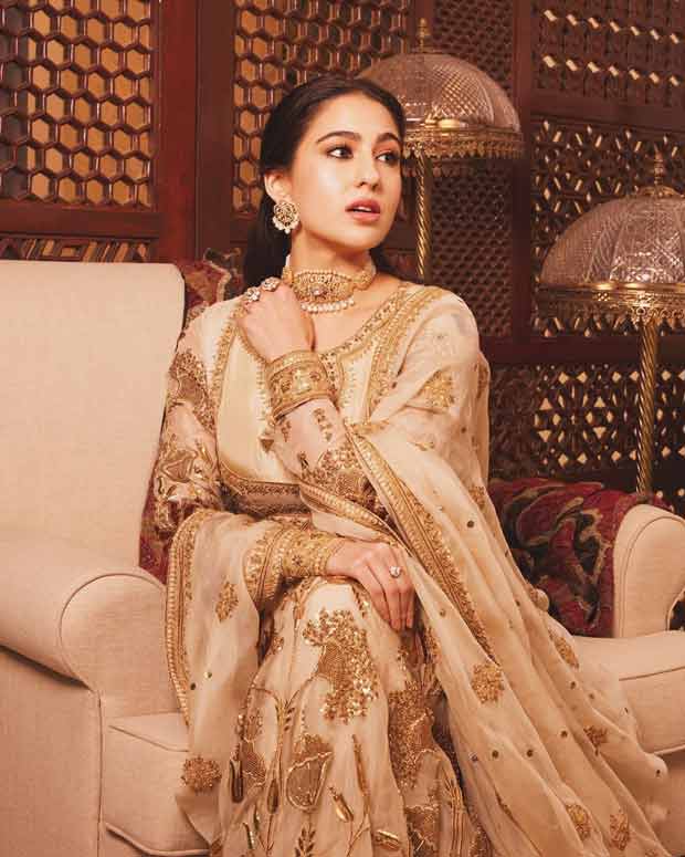 Sara Ali Khan embraces old wolrd charm in Pakistani designer Iqbal Hussain’s ivory pishwas and silk crushed lehenga; Ibrahim Ali Khan complements her with regal Raghavendra Rathore bandhgala