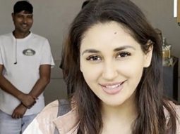 Nikita Dutta cutting cake with paps post her gym session