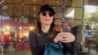 Kanika Kapoor greeting the paps at the aiport