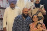 B Praak poses with fans as he gets clicked by paps
