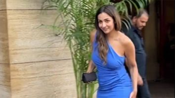 Beautiful Malaika caressing a cute dog