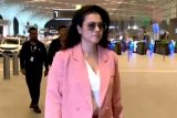 Kajol in a pink boss lady blazer suit papped at the airport