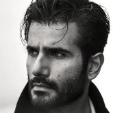 Karan Tacker sets the shore on fire in dreamy Trench Coat shoot; fans call him a ‘storm in stillness’