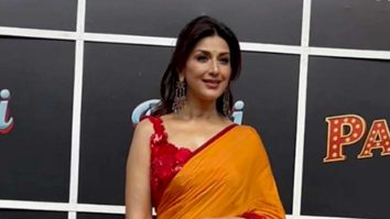Sonali Bendre looks brightening beauty in an orangish red saree