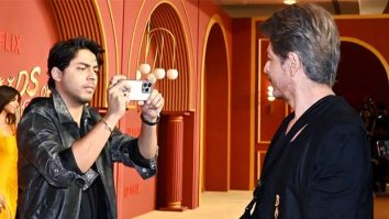 Aryan Khan becomes photographer as Shah Rukh Khan strikes a pose with paparazzi at The Ba***ds of Bollywood premiere